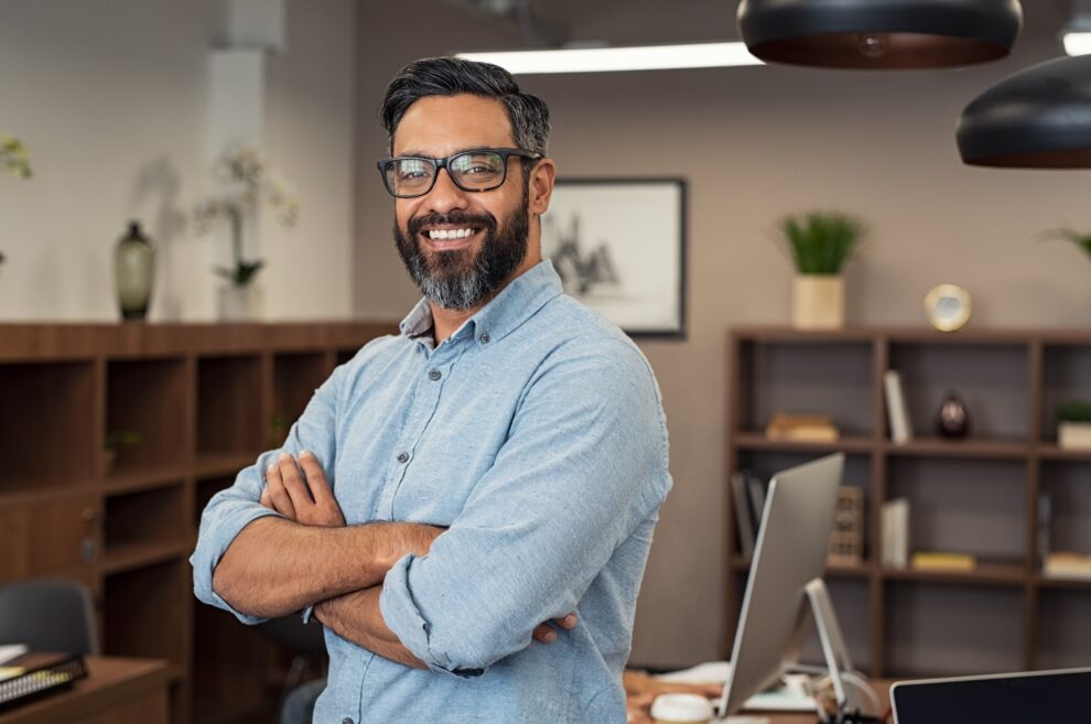 Portrait of happy mature businessman wearing spectacles